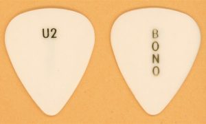 Vintage Bono-inspired guitar pick from U2’s 1987 Joshua Tree world tour period.