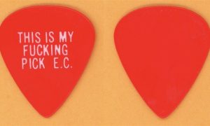 Eric Clapton 1977 Slowhand Tour vintage pick with explicit slogan